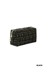 A black quilted cosmetic bag with a textured tweed pattern and gold-tone zip closure, displayed against a white background.