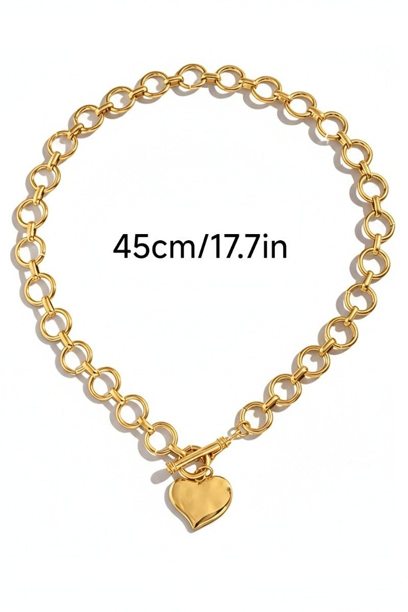 A gold-toned chain necklace featuring interlocking circular links and a polished heart pendant charm. The necklace measures 45cm (17.7 inches) in length.