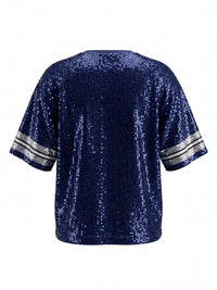 Navy blue sequined short-sleeve top with silver metallic striped trim on the sleeves, displayed on a flat white background. The garment features an all-over sequin design with a relaxed, casual fit.