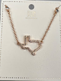 Rose gold-toned necklace from Icon Collector featuring a geometric pendant with crystal embellishments connected to a delicate chain. The pendant displays an angular, abstract design with sparkly rhinestone detailing throughout.