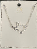 Silver-tone chain necklace from ICON Collection featuring a rhinestone-embellished chevron pendant in the center, displayed on a branded product card with a black circular ornament at the top.