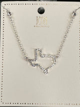 Silver-tone chain necklace from ICON Collection featuring a rhinestone-embellished chevron pendant in the center, displayed on a branded product card with a black circular ornament at the top.