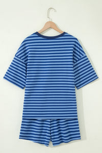 A blue and light blue striped short-sleeve t-shirt and matching shorts set displayed on a wooden hanger against a white background. The coordinating two-piece outfit features horizontal stripes throughout and a relaxed, casual fit.