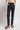 Black acid-wash straight-leg jeans with cargo pockets and a high waist, styled with a beige crop top and brown slide sandals.
