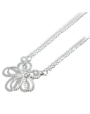 A silver-tone pendant necklace featuring a decorative flower or bow design embellished with sparkling cubic zirconia stones, suspended from a delicate chain.