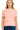 A woman wearing a coral and white striped short-sleeve crew neck t-shirt paired with dark denim jeans, standing against a white background.