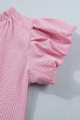 A pink and white striped short-sleeved garment with an elastic waistband and ruffled hem details, displayed flat against a light gray background.