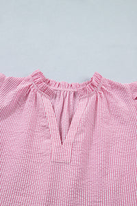 A pink and white striped off-shoulder top with a ruffled neckline and short puffed sleeves, displayed flat against a light gray background.