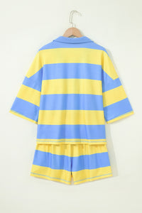 A children's two-piece set featuring a short-sleeved striped shirt and matching shorts in alternating blue and yellow horizontal stripes, displayed on a wooden hanger against a white background.