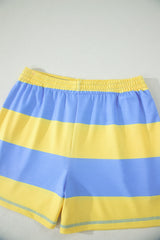 Blue and yellow striped swim shorts with an elastic waistband and reflective trim at the hem. The shorts feature horizontal color-blocking with alternating blue and yellow stripes throughout.