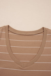 A tan ribbed tank top with white horizontal stripes, featuring a V-neckline and fitted shoulders, displayed flat against a neutral beige background.