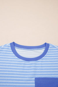A blue and white striped short-sleeve t-shirt with a crew neckline and solid blue ribbed trim, displayed flat on a neutral beige background.
